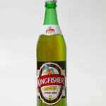 Harlow, United Kingdom - February 27, 2014: In a studio setting, a record picture of a 660ml bottle of Kingfisher brand beer with 4.8% alcohol by volume. The beer is brewed by Heineken UK limited in Edinburgh, UK, under license from Kingfisher Beer Europe Limited (Maidstone, Kent, England).